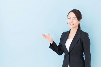 portrait of asian businesswoman on blue background