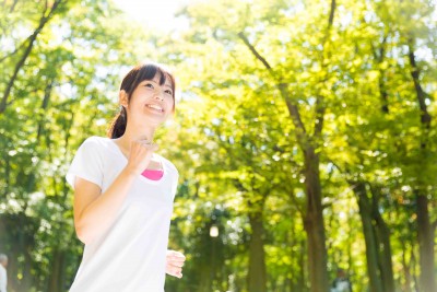 young asian woman jogging image