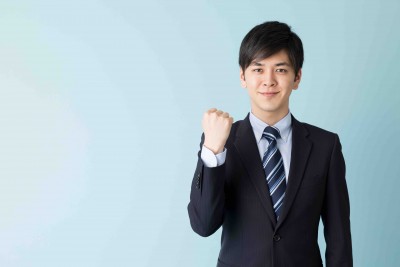 portrait of asian businessman isolated on blue background